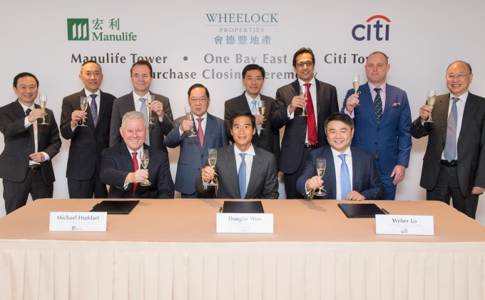 The management team of Wheelock Properties, Manulife and Citi celebrate the purchase closing of One Bay East.