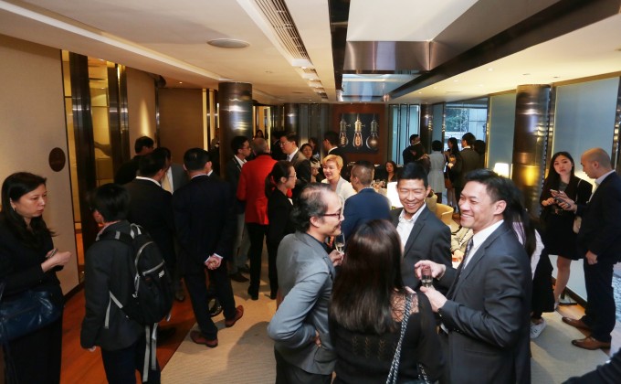 Guests mingled at the Buddy Bar during the opening of the HKSTP @Wheelock Gallery. 